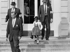 U.S. Deputy Marshals escort 6-year-old Ruby Bridges from William Frantz School in New Orleans in 1960